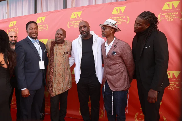 A group of filmmakers and guests on the red carpet